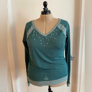 Sparkle in this comfy green long sleeve shirt.